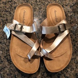 Never worn gold sandals; still have tags on.